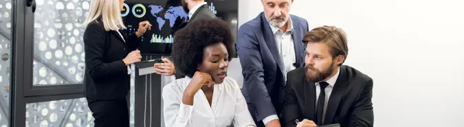 Team of professionals discussing IT systems management, representing Exigo Tech's Managed Services delivery model in Australia for reliable infrastructure and operations Team of professionals discussing IT systems management, representing Exigo Tech's Managed Services delivery model in Australia for reliable infrastructure and operations