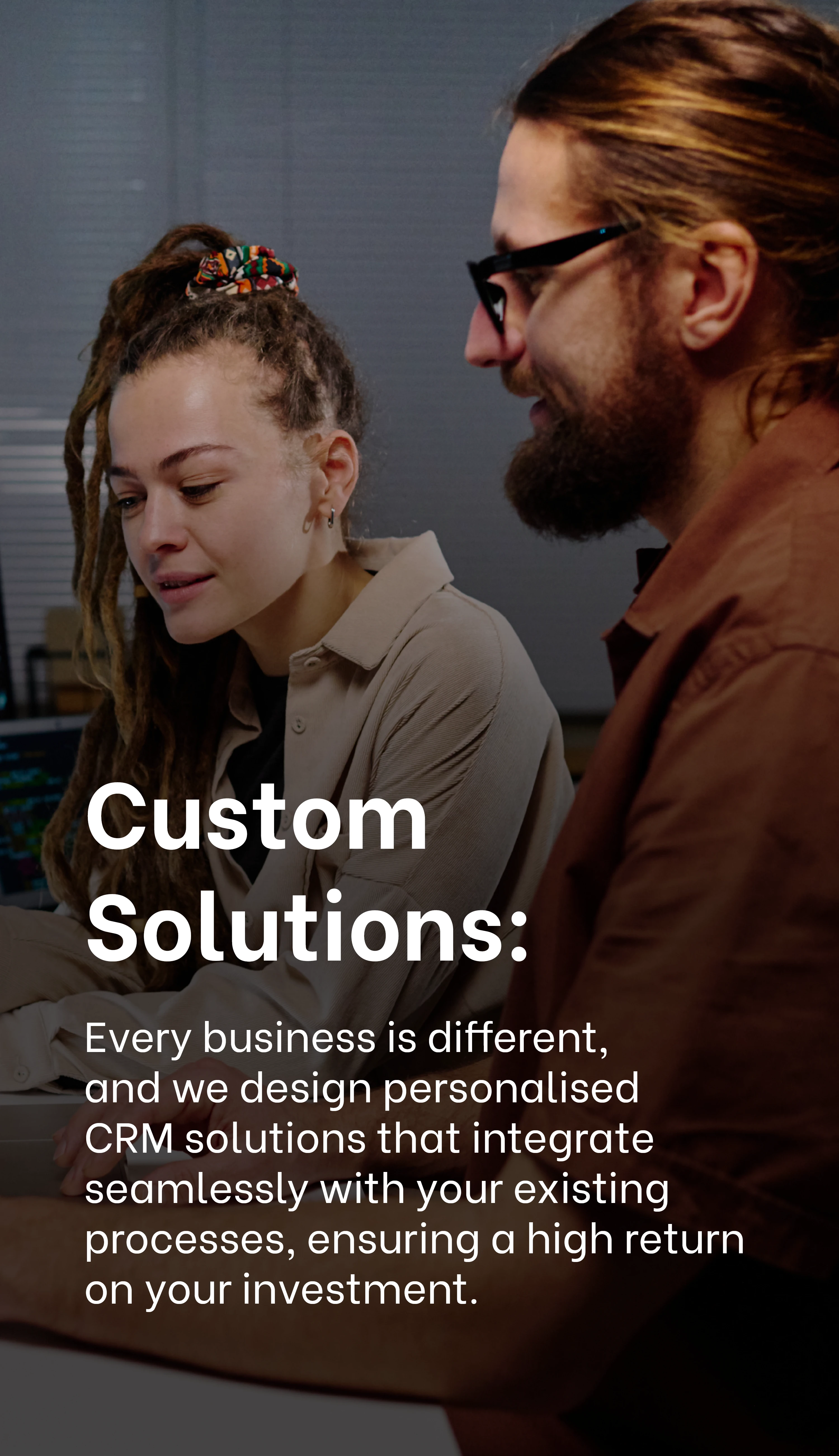 Custom Solutions: Professionals collaborating on personalized CRM solutions for businesses at Exigo Tech Custom Solutions: Professionals collaborating on personalized CRM solutions for businesses at Exigo Tech