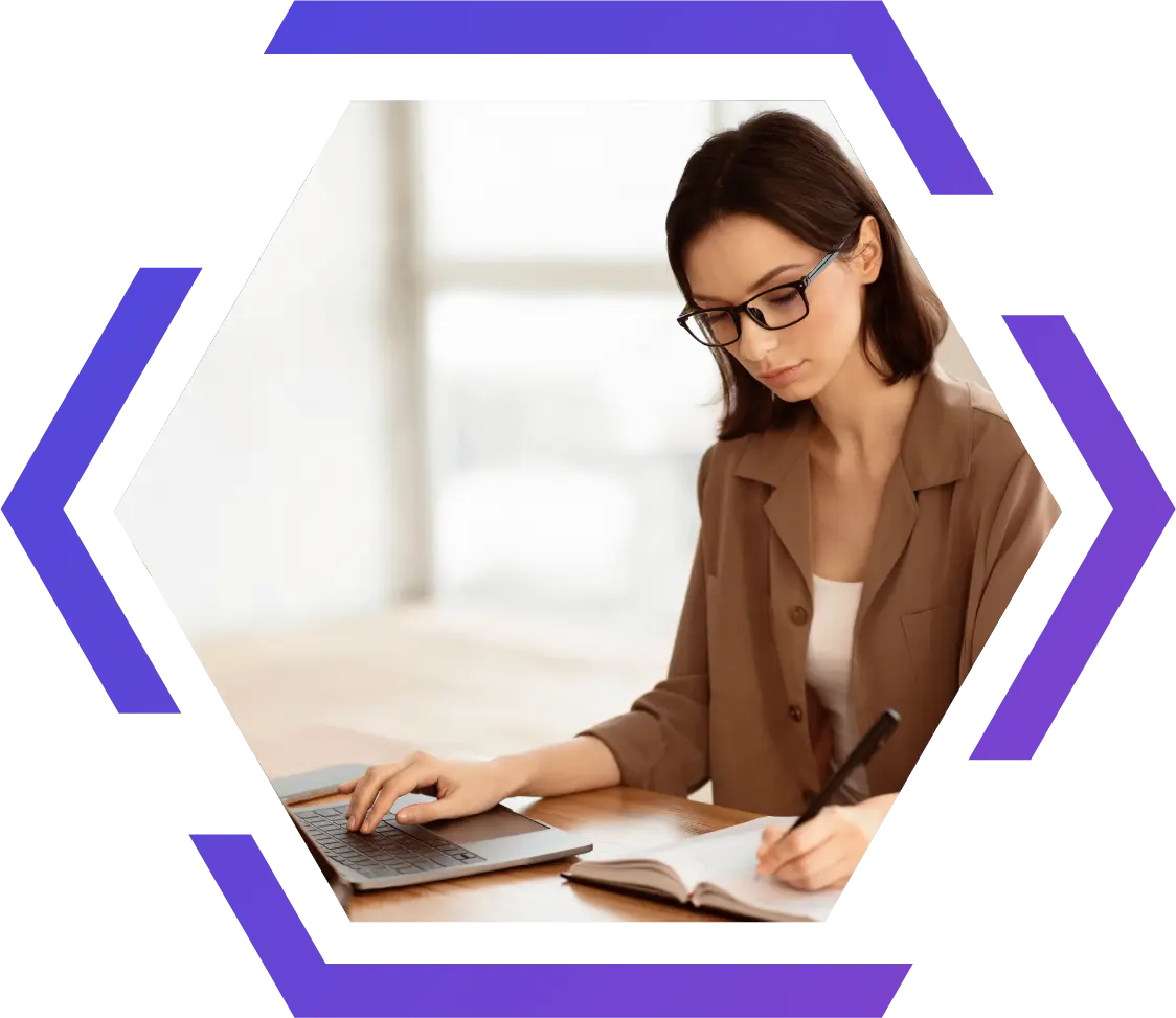 chatbot-hex_WEBP Woman working on content creation using a laptop and notebook, representing Exigo Tech's AI-powered content generator for creating personalized, SEO-optimized, and compliant content.