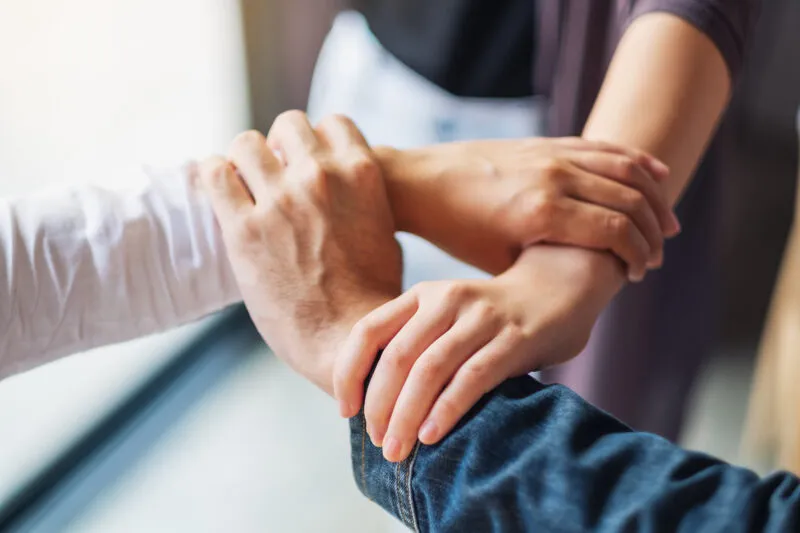 Exigo Tech Perks: Hands joined together, symbolizing support, well-being, and a strong employee assistance program. Exigo Tech Perks: Hands joined together, symbolizing support, well-being, and a strong employee assistance program.