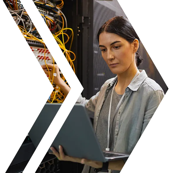 cta-banner-azure-arc-workshop-cropped IT specialist managing cloud infrastructure using a laptop in a server room