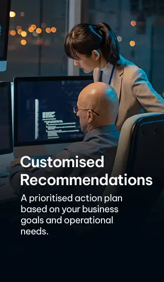 Professionals discussing customized cybersecurity recommendations with multiple monitors - For Mobile version Professionals discussing customized cybersecurity recommendations with multiple monitors - For Mobile version