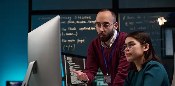 Professionals discussing Zero Trust model for cybersecurity and access verification